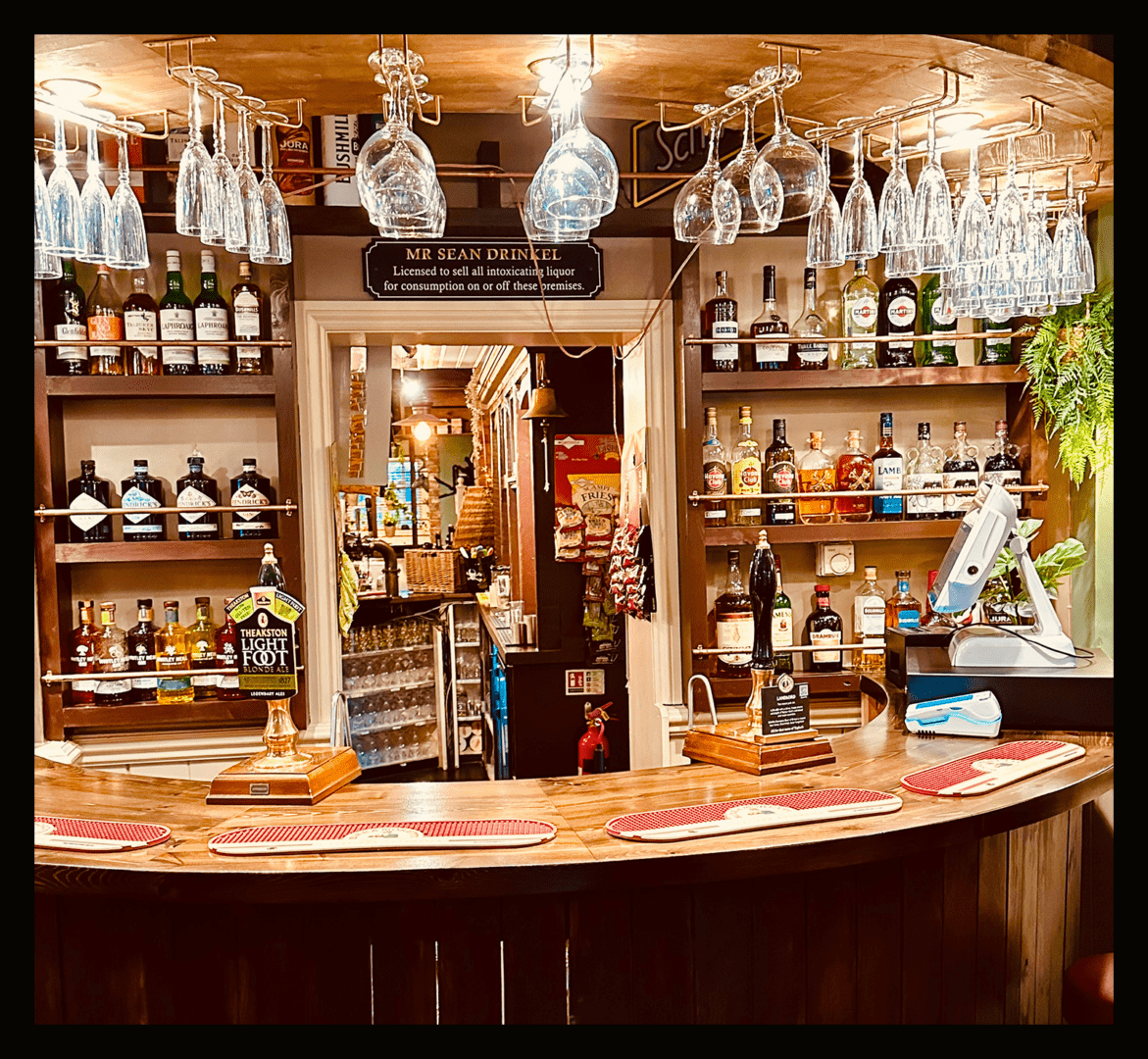Well-stocked bar with liquor bottles