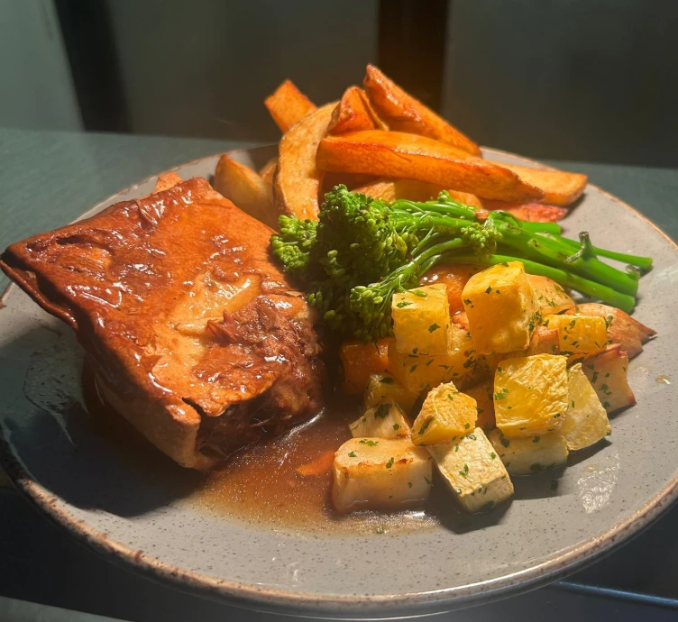 Hearty meal with pie and vegetables